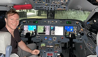 Patrick in a Gulfstream cockpit